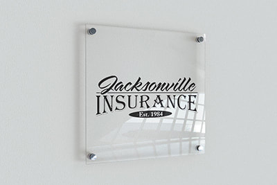 Jacksonville Insurance logo printed on a glass frame